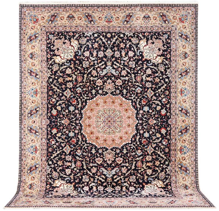 A semi.antique Tabriz carpet, 50 raj, c. 390 x 290 cm.