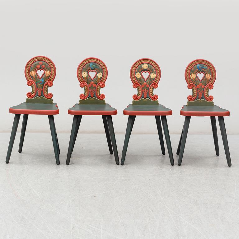 A second half of the 20th Century dining table and four chairs painted by the Hungrarian artist Laszlo Holló.