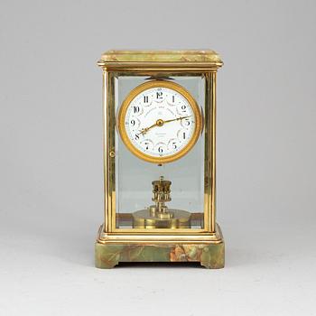 A French onyx and brass mantel clock, first half of the 20th century.