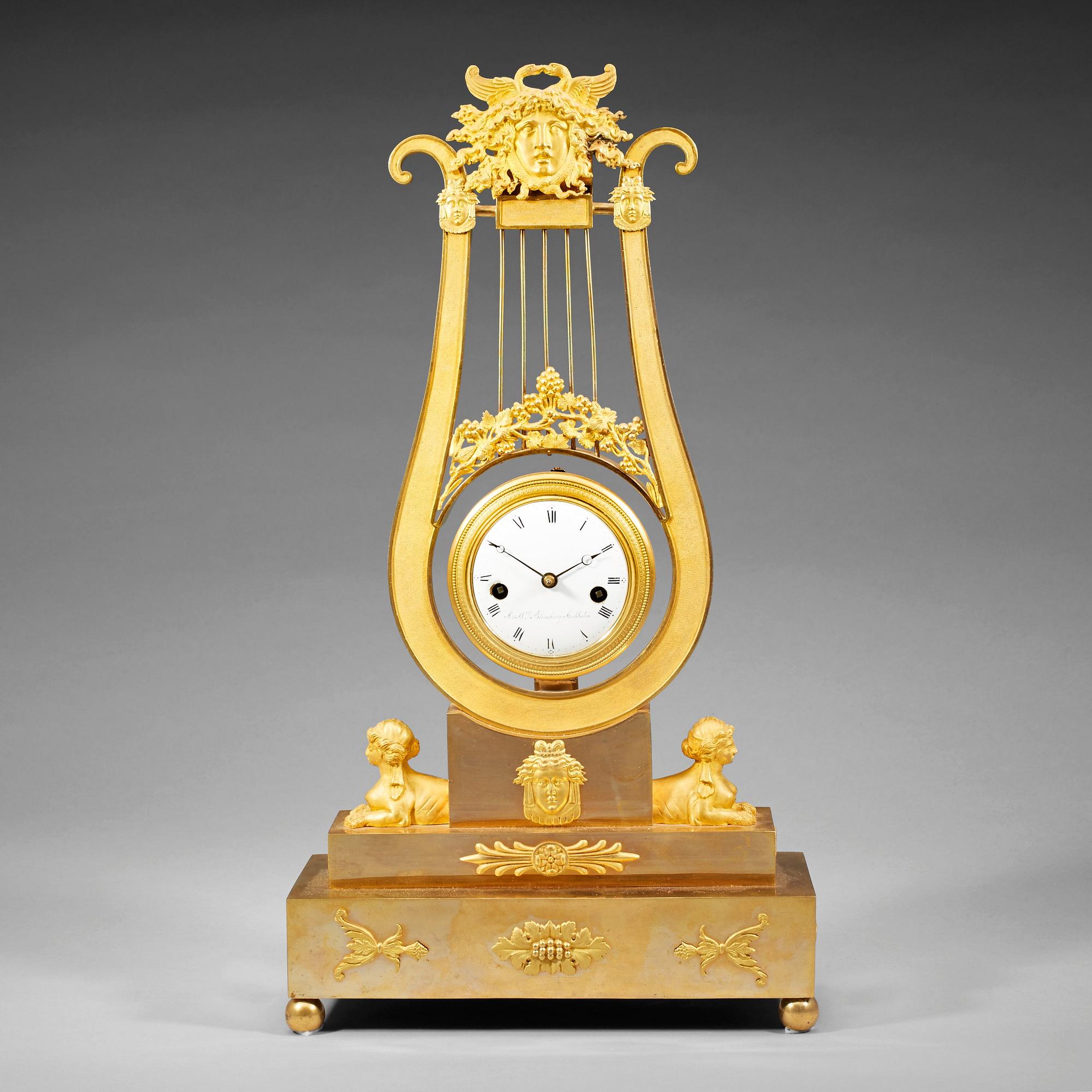 A late Gustavian early 19th century gilt bronze mantel clock.
