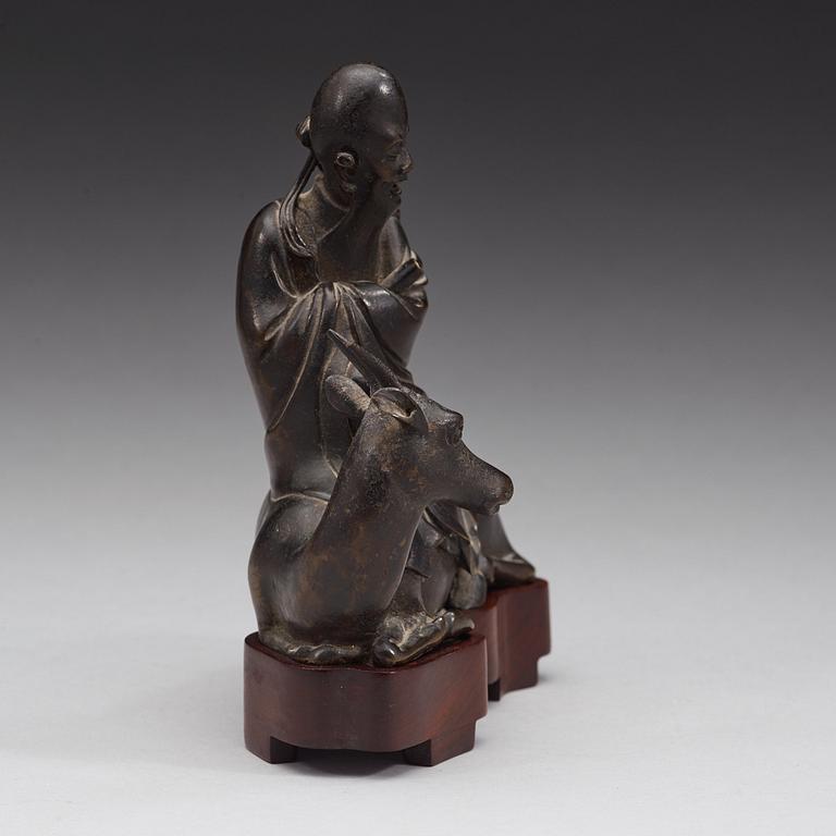 A bronze figure of Sholou on a reclining deer, Qing dynasty (1644-1912).