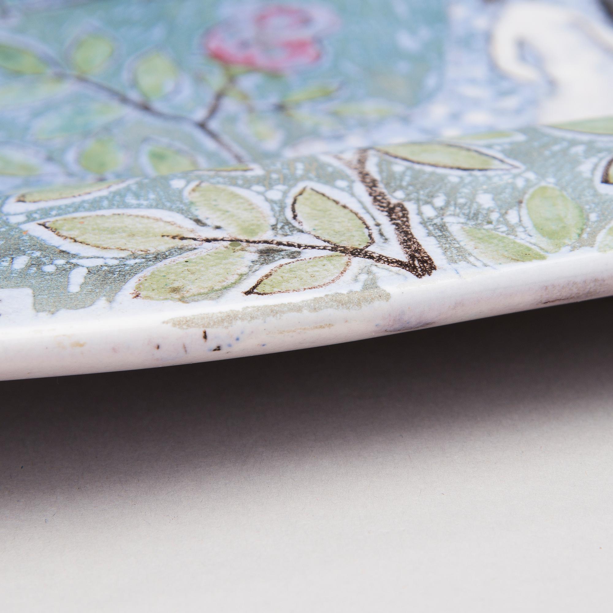 A ceramic plate signed Bryk Arabia.