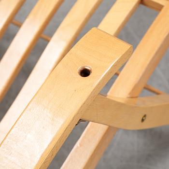 A pair of elm wood lounge chairs, Brogrens, second half of the 20th Century.