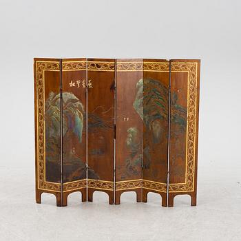 A Chinese six panel wooden folding screen, first half of the 20th Century.