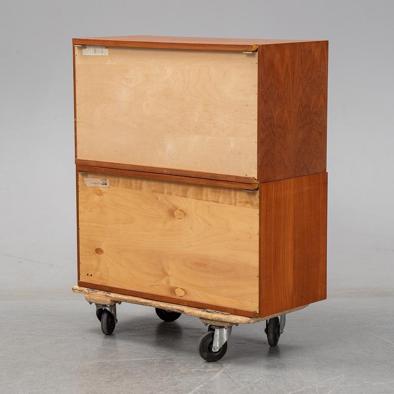 A 1960's teak shelving system by Poul Cadovius.