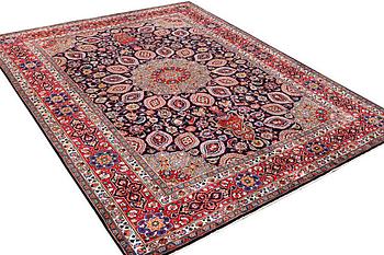 A Meshed carpet, c. 352 x 255 cm.