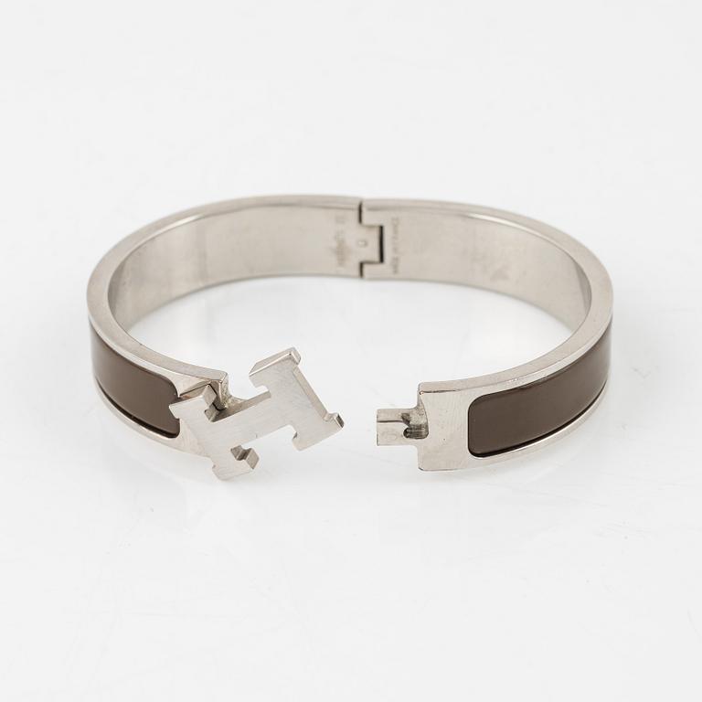 Hermès, a 'Clic H' bracelet.
