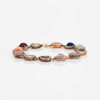 A BRACELET set with coloured stones and rose-cut and old-cut diamonds.