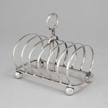 An English 20th century silver-plated toast rack, marked WH.