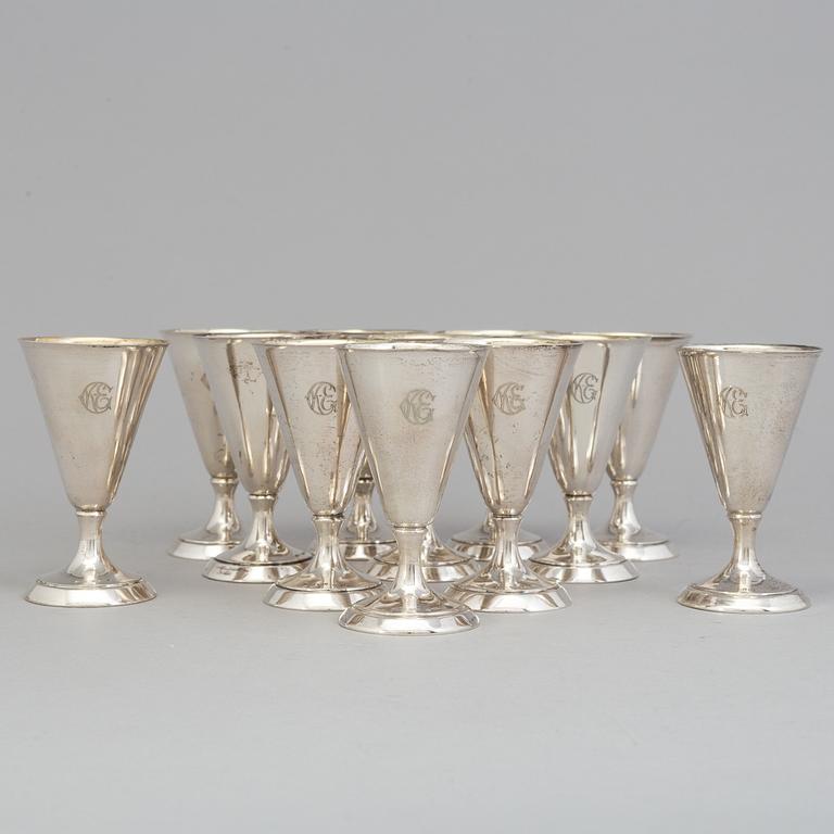 a set of twelve silver drinking cups from around 1936. Weight 175 g.