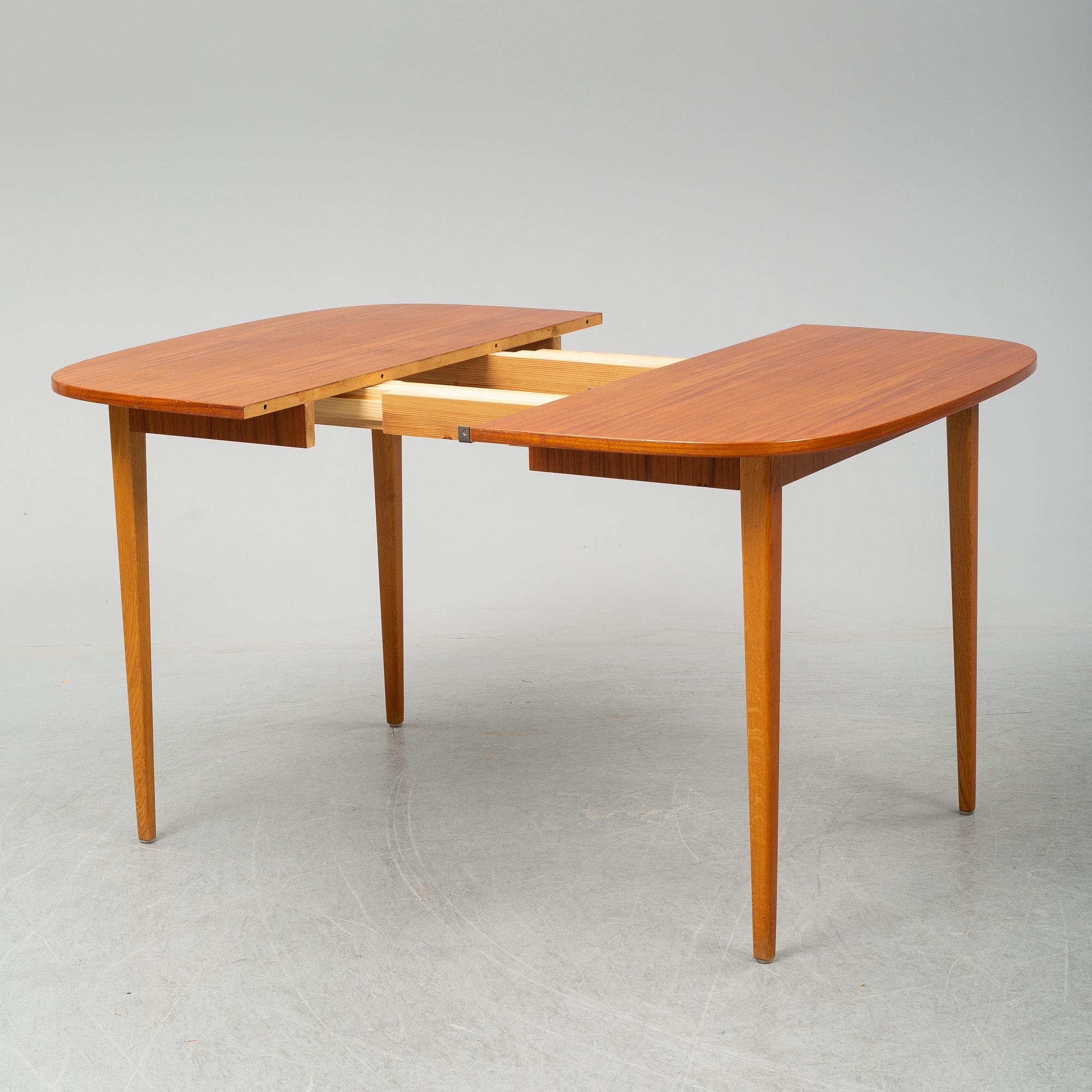A second half of the 20th Century teak dining table.