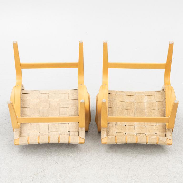 Bruno Mathsson, a pair of 'Eva' armchairs, DUX, Sweden, second half of the 20th century.