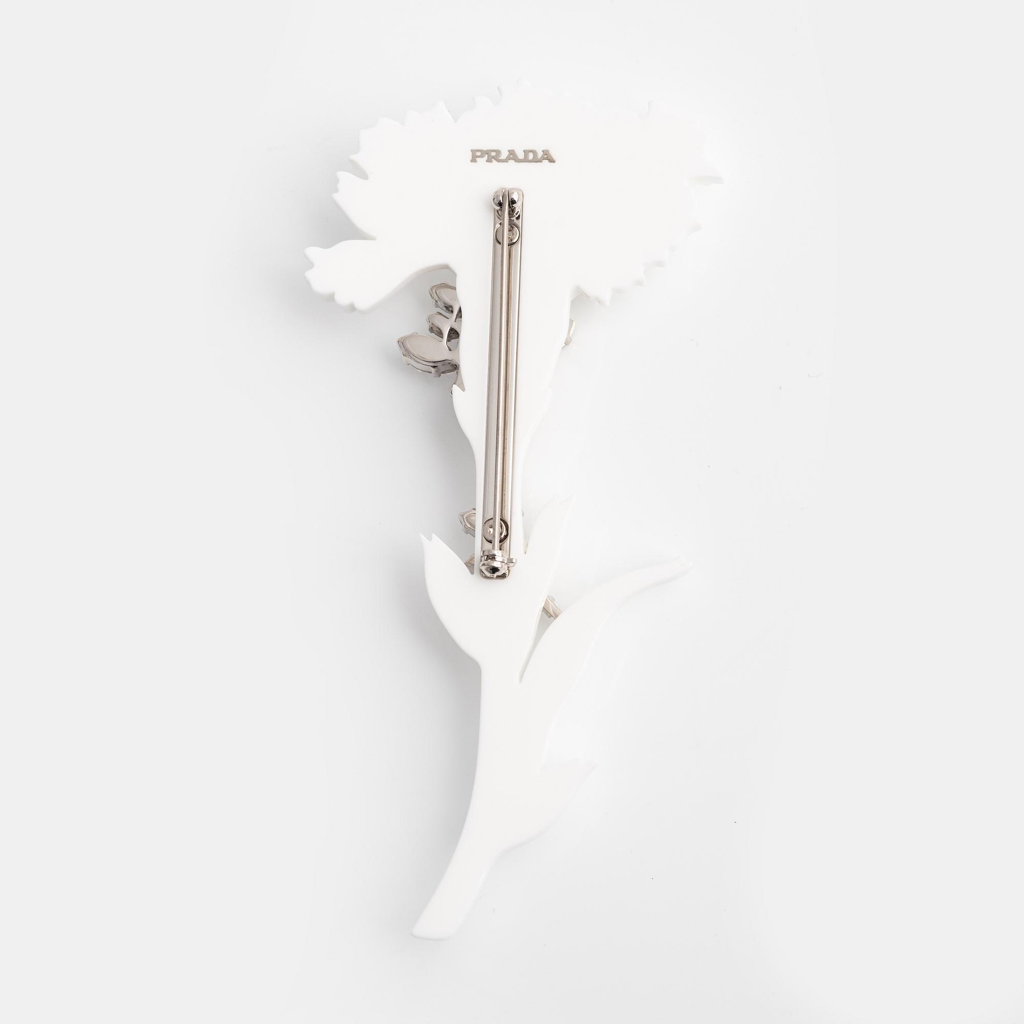 Prada, Acrylic and strass brooch. - Bukowskis