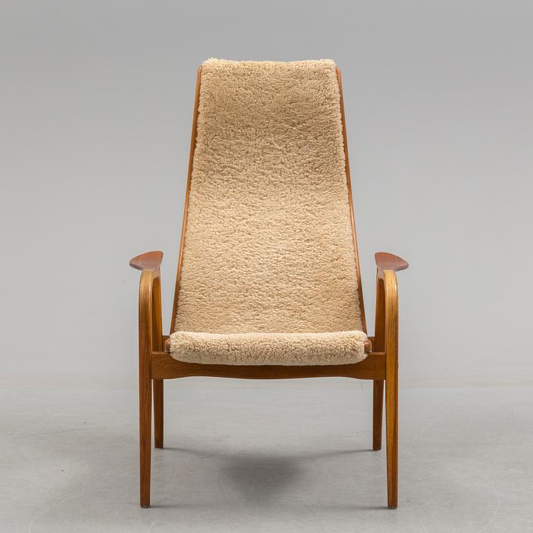 A Yngve Ekström teak and oak armchair.