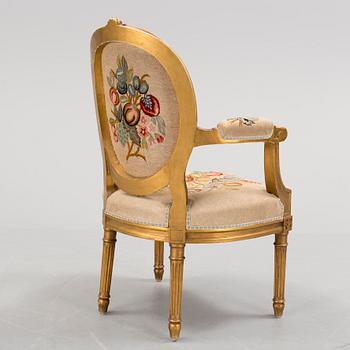 A Gustavian style arm chair, first half ot the 20th Century.
