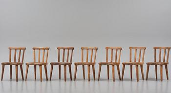 Axel Einar Hjorth, a set of seven stained pine "Utö" chairs, Nordiska Kompaniet, Sweden, 1930s.