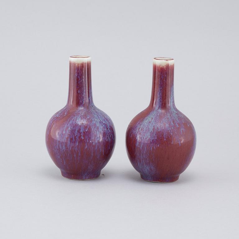A pair of sang de boeuf vases, 20th cenutry.