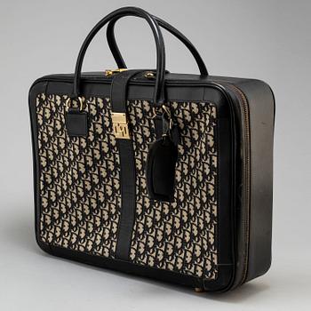 CHRISTIAN DIOR, a suitcase.