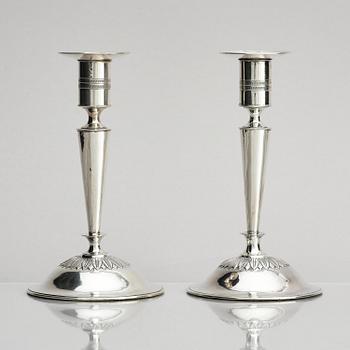 Two pair of early 19th century silver candlesticks, marks of Anders Lundqvist, Stockholm, Sweden 1819 and 1821.