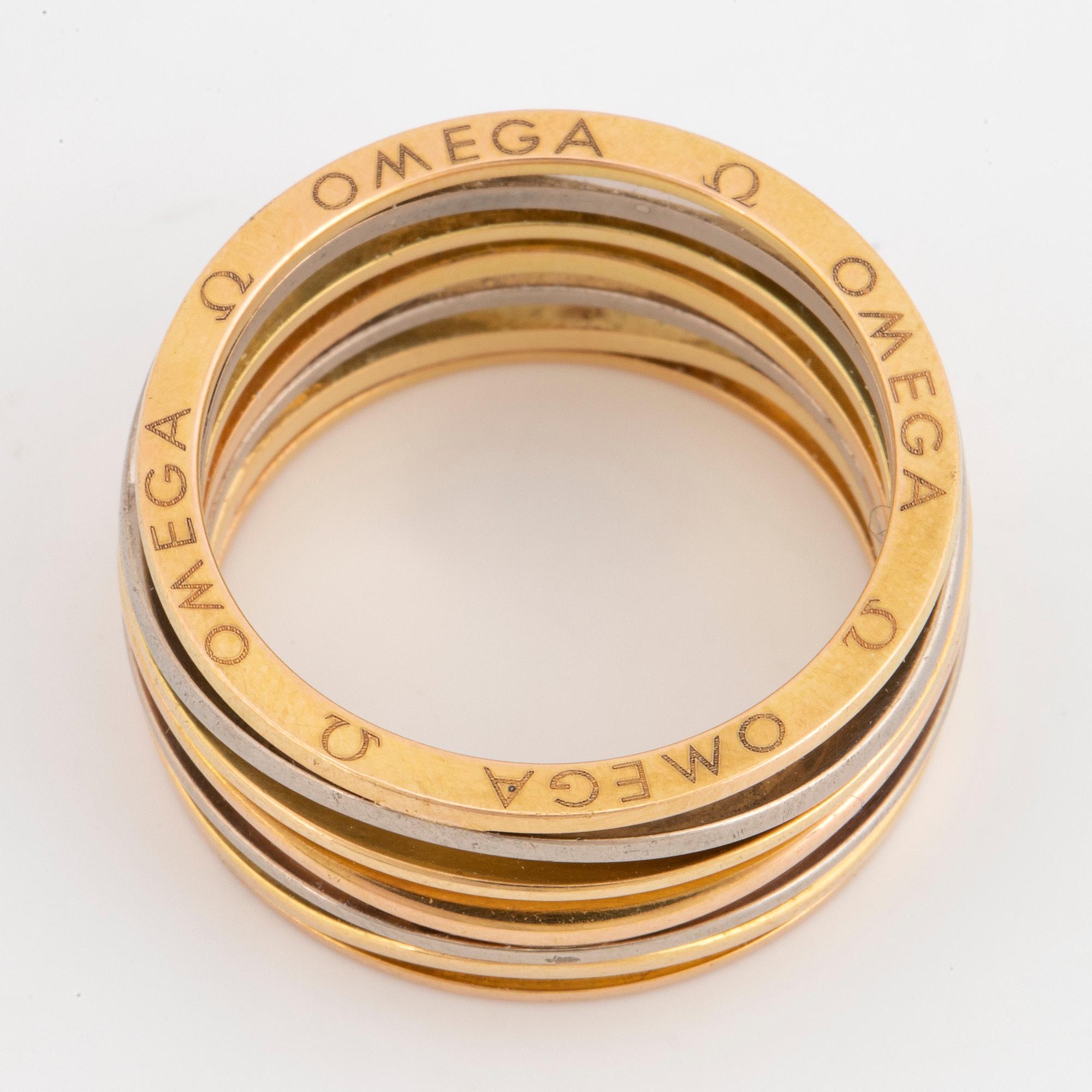 18K gold Omega ring.