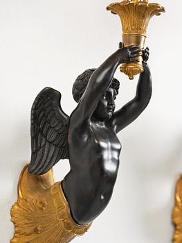A pair of Napoleon III five-branch gilt and patinated bronze appliques.