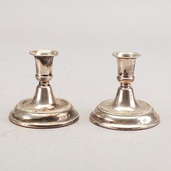 A set of three pair of Swedish 20th century silver candle sticks.