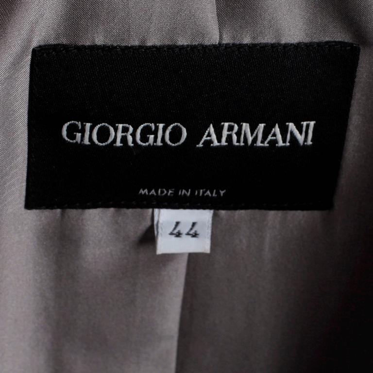 GIORGIO ARMANI, a three-piece suit consisting of jacket, pants and topp.