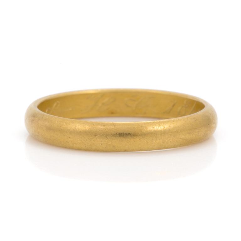 A 23K gold ring.