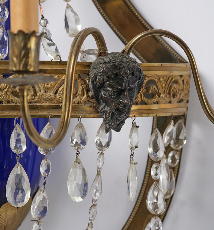 A pair of Russian Louis XVI-style  four-branch gilt bronze appliques, 19th century.