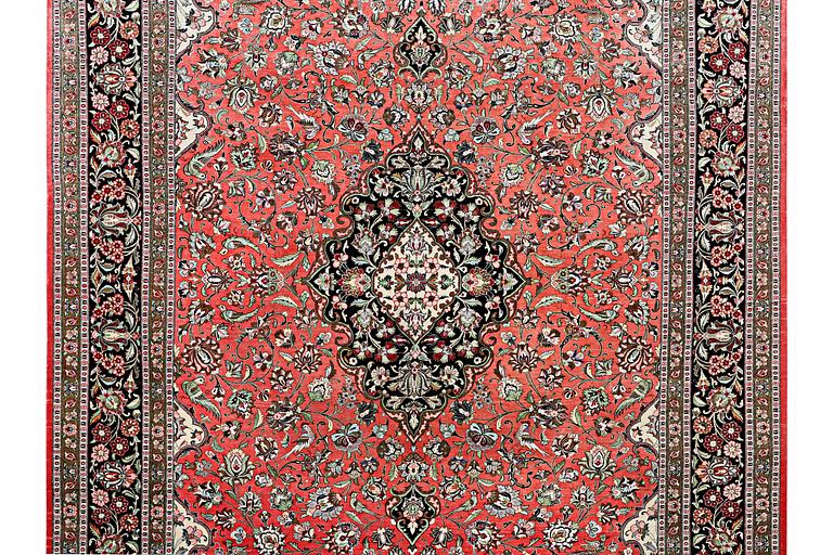 A silk Quum carpet, c. 305 x 205 cm.