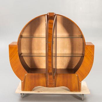 An English 1940s Art Deco walnut display cabinet.