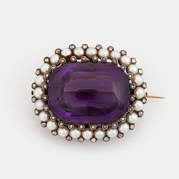 501. A silver and gold brooch/pendant set with an amethyst and pearls and rose-cut diamonds.