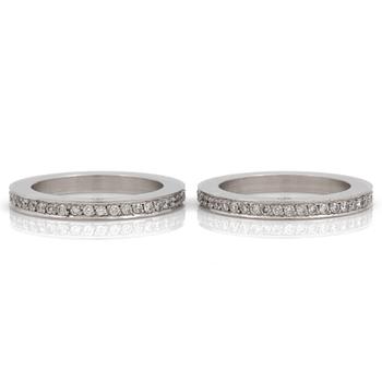 Two eternity rings, set with brilliant cut diamonds, total carat weight circa 1.00 cts.