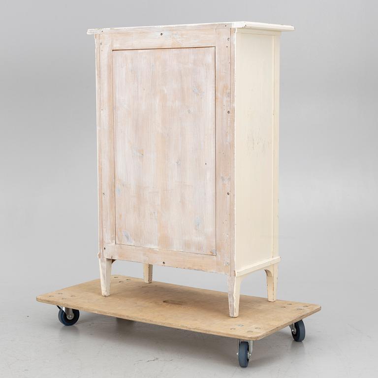 A display cabinet, early 20th century.