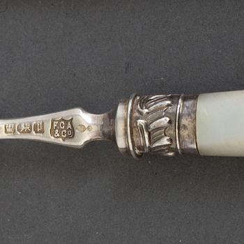 A set of 24 silver and mother of pearl cutlery by  Frederick C. Asman & Co, Sheffield, England, 1907.