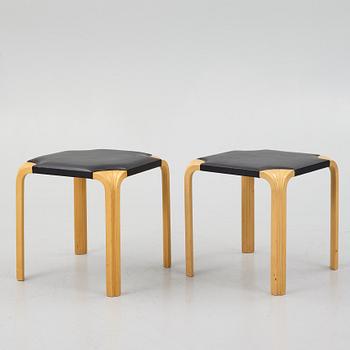 Alvar Aalto, a pair of 'X601' stool for Artek, later half of the 20th century.