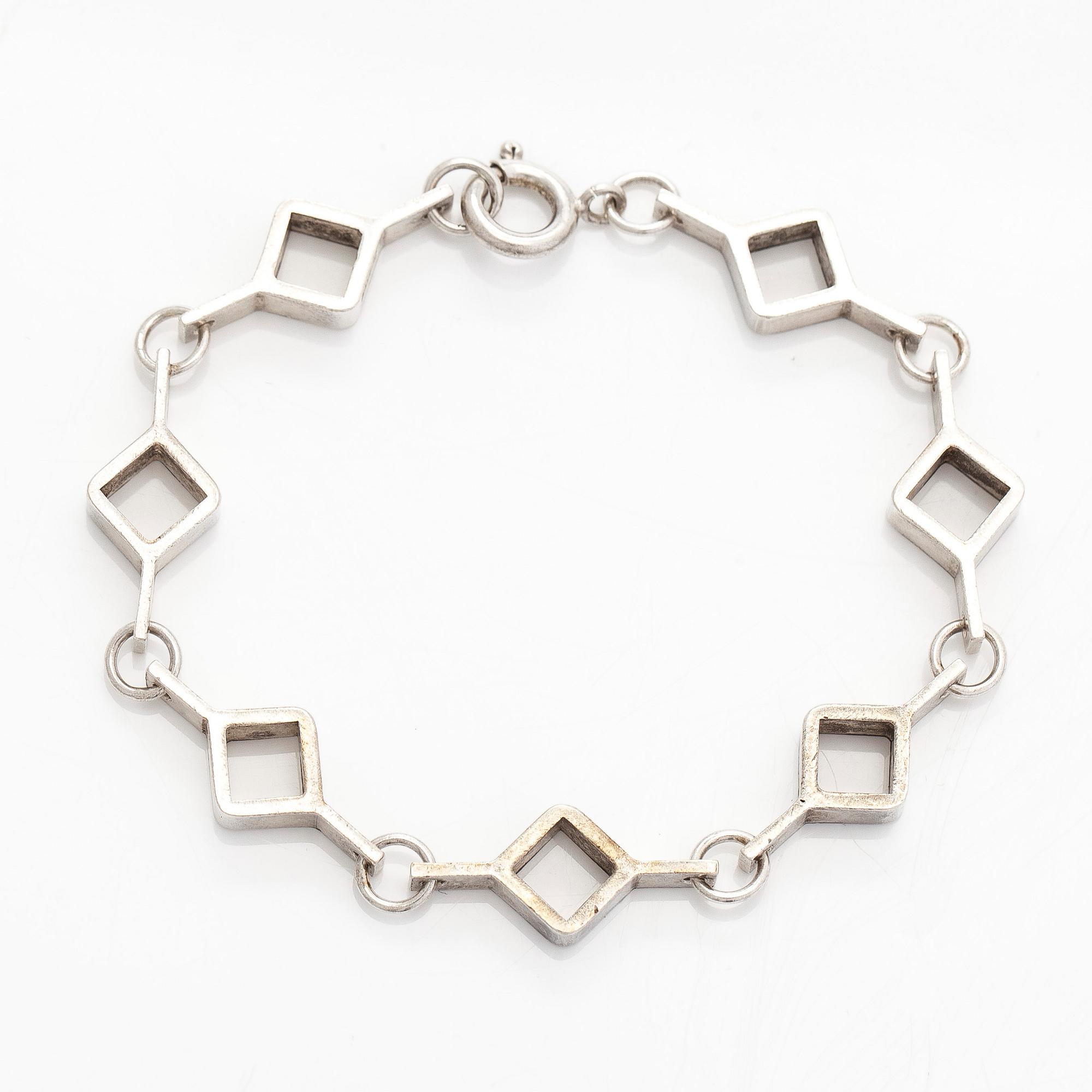 Jorma Laine, a set of two silver pendants, a bracelet and a brooch. Kultateollisuus Oy, Turku 1965-1972.