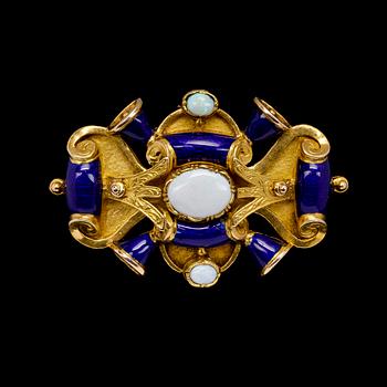 1056. BROOCH, blue enamel and opal, 18/1900.