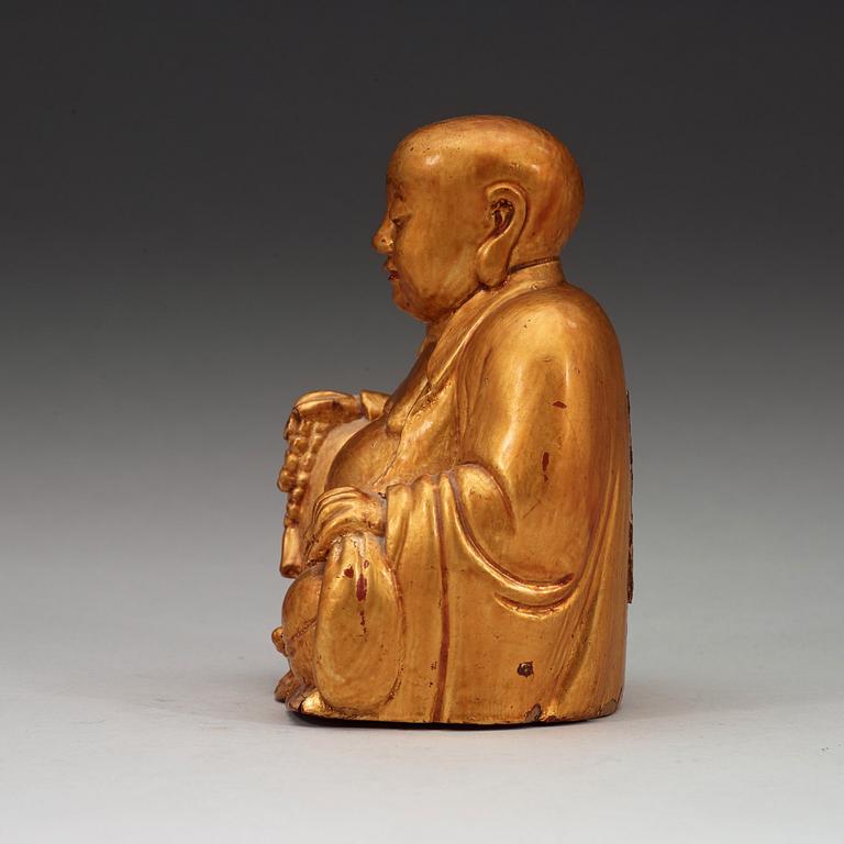 A gilt and lacquered figure of Budai,  Qing dynasty (1644-1912).