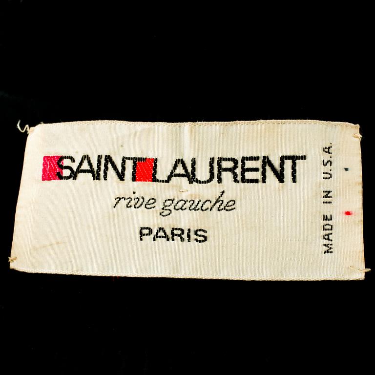 YVES SAINT LAURENT, a two-piece black velvet dress consisting of jacket and skirt, from the Russian collection.