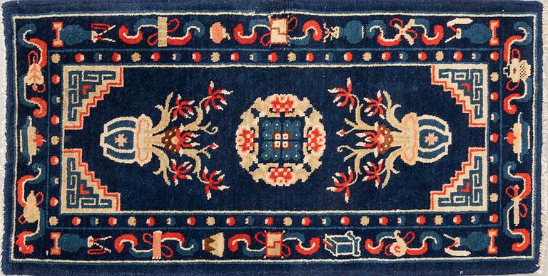 A semiantique Chinese Baotou carpet approx 106x58 cm.
