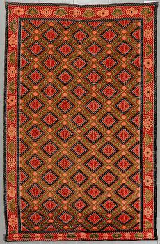 A wall textile, signed, around the year 1900, 208 x 130 cm.