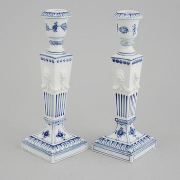 A pair of "Musselmalet" candel holders made by Royal Copenhagen, 20th century.