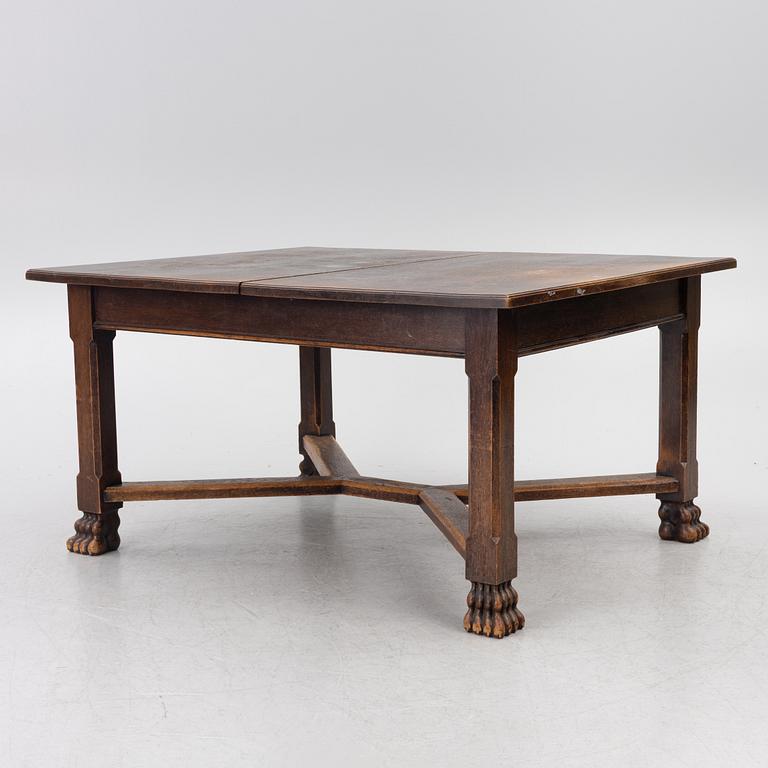 A Baroque-style dining table with six chairs, around 1900.