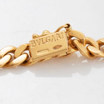 Bulgari "Monete" collier 18K guld med ett romerskt mynt och en baguetteslipad diamant.