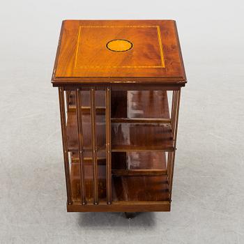 A swivel bookshelf veneered with mahogany from the second half of the 20th century.