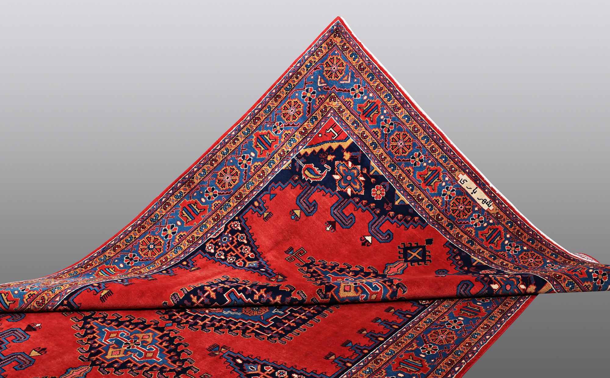 A CARPET, Wiss Signed Sharbani.  327 x 227 cm.