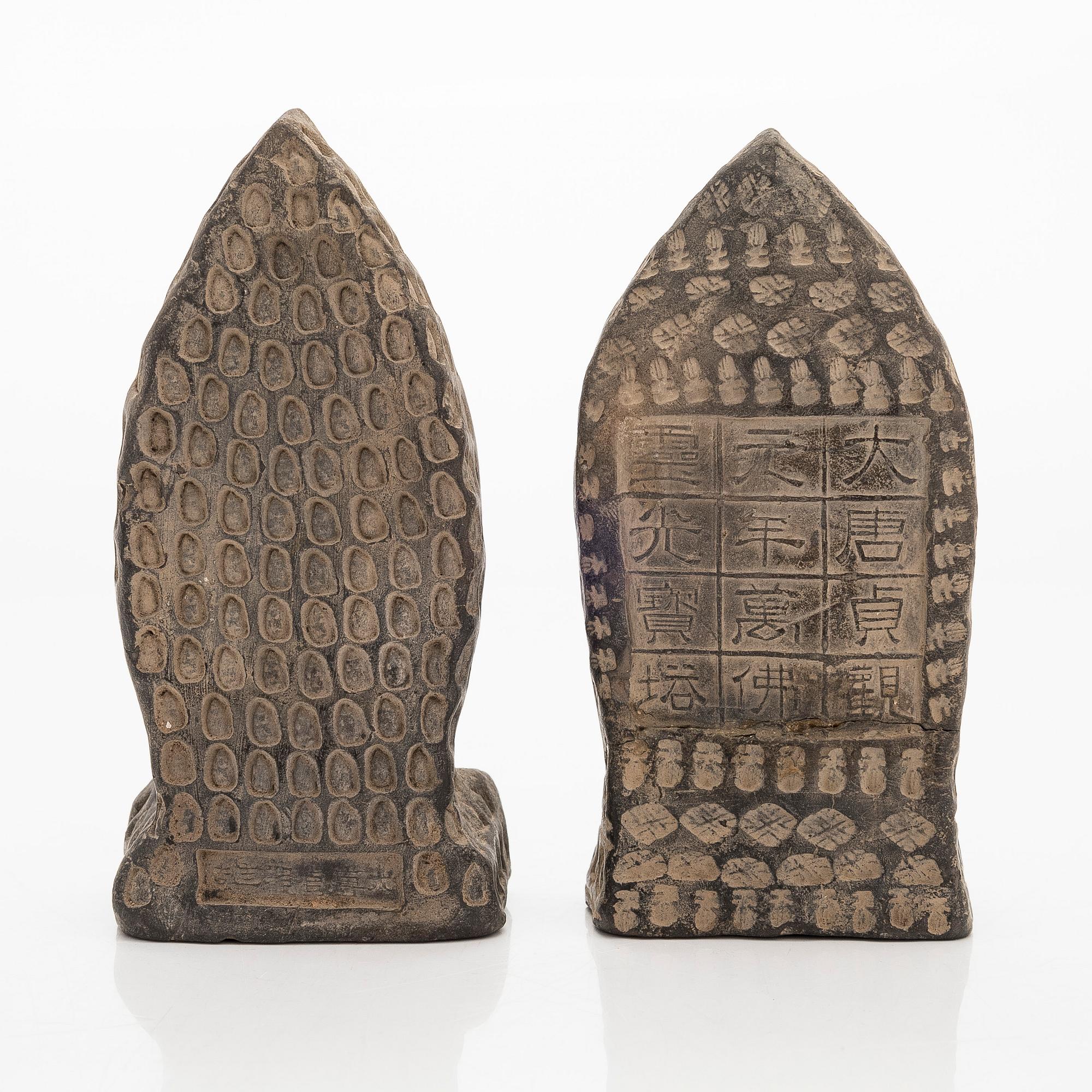 Two steles/tsa tsas, presumably circa 1900.