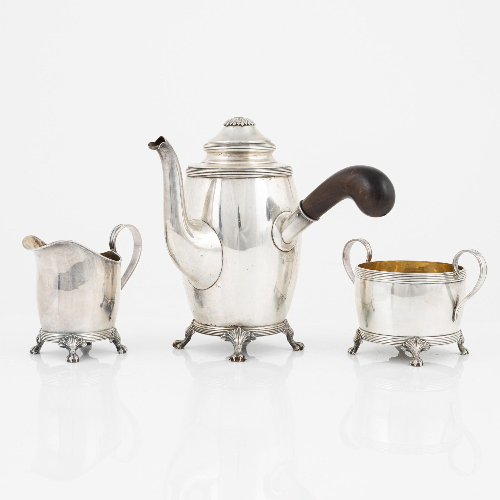 A Swedish Silver Coffee Pot, Creamer and Sugar Bowl, mark of CG Hallberg, Stockholm 1917-18.