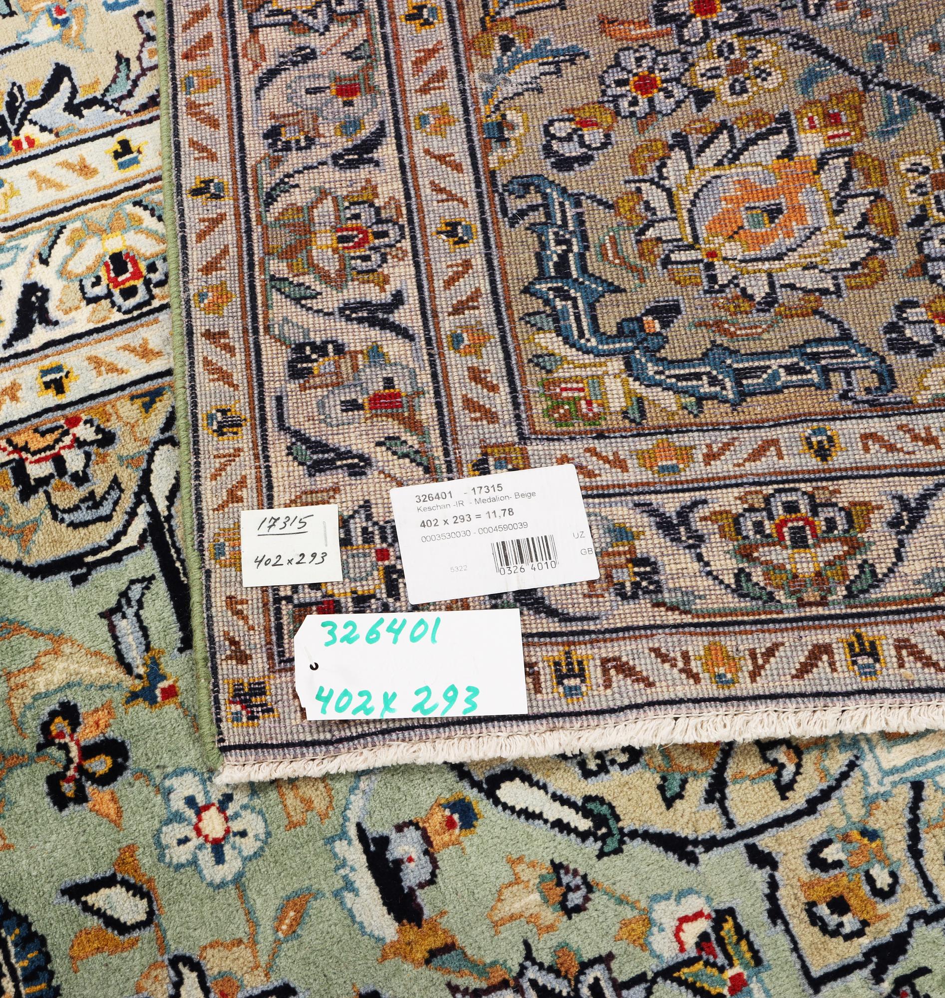 A Kashan carpet, c. 402 x 293 cm.